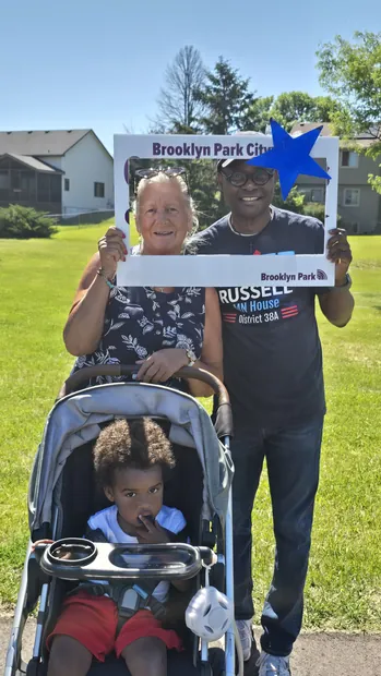 Wynfred Russell with a Brooklyn Park resident