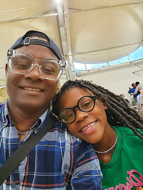 Wynfred Russell with a young supporter